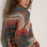 Broderick's Clothing Co. apricot mixed yarn boho jumper with open-knit stripes, mock neck, and oversized fit.