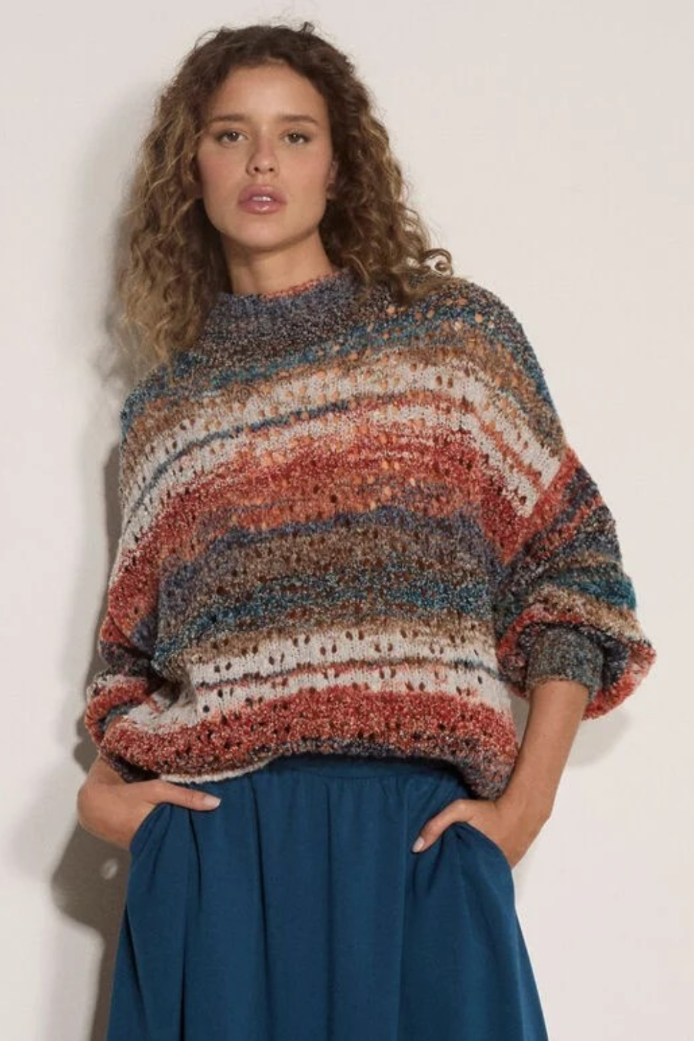 Broderick's Clothing Co. apricot mixed yarn boho jumper with open-knit stripes, mock neck, and oversized fit.