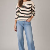 Broderick's Clothing Co. apricot crew neck sweater with black stripes and small red embroidered hearts.