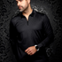 Man wearing a black Au Noir AVENOR long sleeve knit polo with a structured collar from Broderick's Clothing Co.