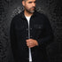 Broderick's Clothing Co. Au Noir GRADO black overshirt worn by a man over a white t-shirt with button-down pockets.