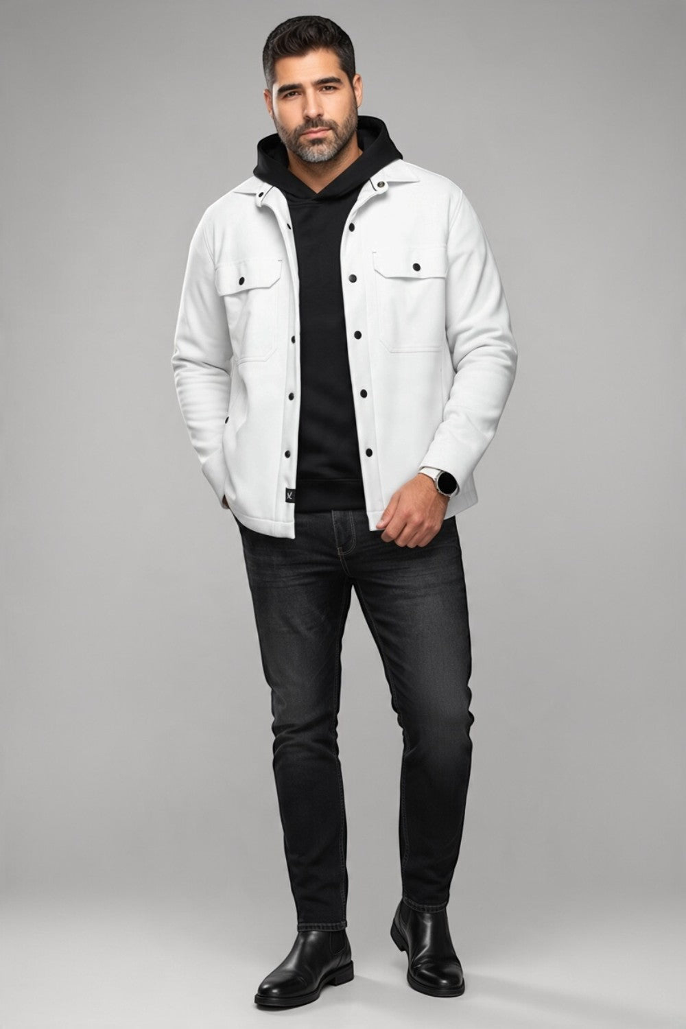 Model wearing a white Broderick's Clothing Co. Au Noir GRADO overshirt over a black hoodie and dark jeans