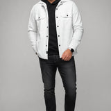 Model wearing a white Broderick's Clothing Co. Au Noir GRADO overshirt over a black hoodie and dark jeans