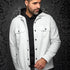 Broderick's Clothing Co. Au Noir GRADO white overshirt with black buttons worn over a black hoodie by a male model