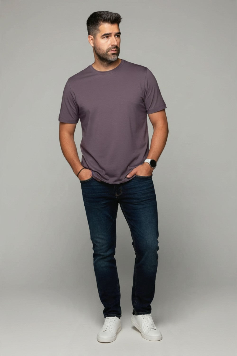 Man wearing a Broderick's Clothing Co. Au Noir C-MAVEN mauve modal and mercerized cotton t-shirt with dark blue jeans