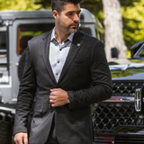 Broderick's Clothing Co. Au Noir SCARPA blazer in charcoal grey worn by a man with a patterned shirt outdoors