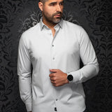 Broderick's Clothing Co. Au Noir Alexander silver long sleeve knit dress shirt on a model against a damask background