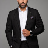 Broderick's Clothing Co. Au Noir TYCHO charcoal grey blazer worn by a bearded man with a white shirt and pocket square