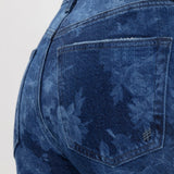 Broderick's Clothing Co. Avery high rise jeans in blue floral denim with a contoured waistband and back pocket detail.