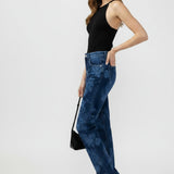 Broderick's Clothing Co. Avery high rise straight leg jeans in blue acid wash worn by a model with a black top