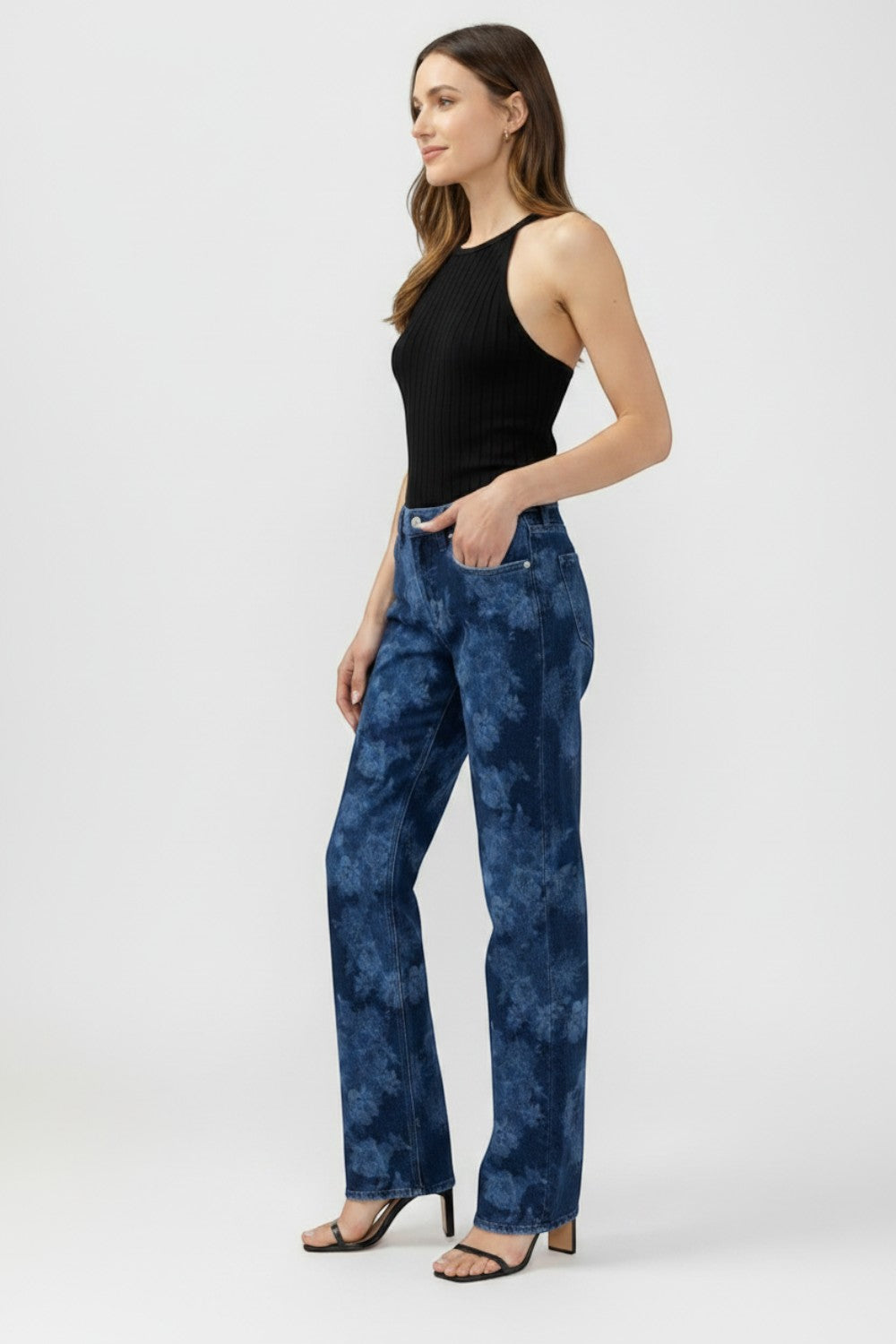 Broderick's Clothing Co. Avery high-rise straight leg jeans in a blue acid wash denim worn by a model