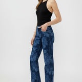 Broderick's Clothing Co. Avery high-rise straight leg jeans in a blue acid wash denim worn by a model