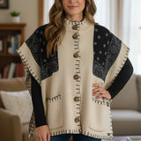 Broderick's Clothing Co. cream and black bandana print knit poncho with button front and whip-stitch edge detail.
