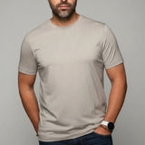 Broderick's Clothing Co. Au Noir C-MAVEN beige modal and mercerized cotton t-shirt worn by a man with a beard.