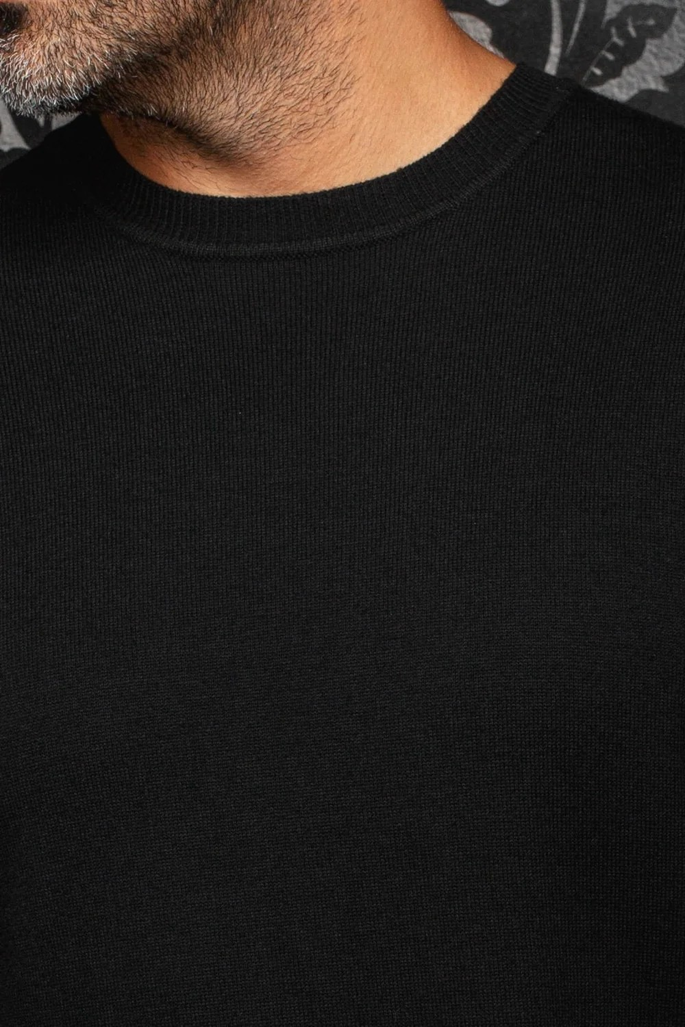 Broderick's Clothing Co. Au Noir LACAUNE black cashmere sweater with a classic crew neck worn by a man