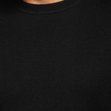 Broderick's Clothing Co. Au Noir LACAUNE black cashmere sweater with a classic crew neck worn by a man