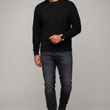 Broderick's Clothing Co. Au Noir LACAUNE black cashmere sweater worn by a man with dark jeans and black boots