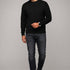 Broderick's Clothing Co. Au Noir LACAUNE black cashmere sweater worn by a man with dark jeans and black boots