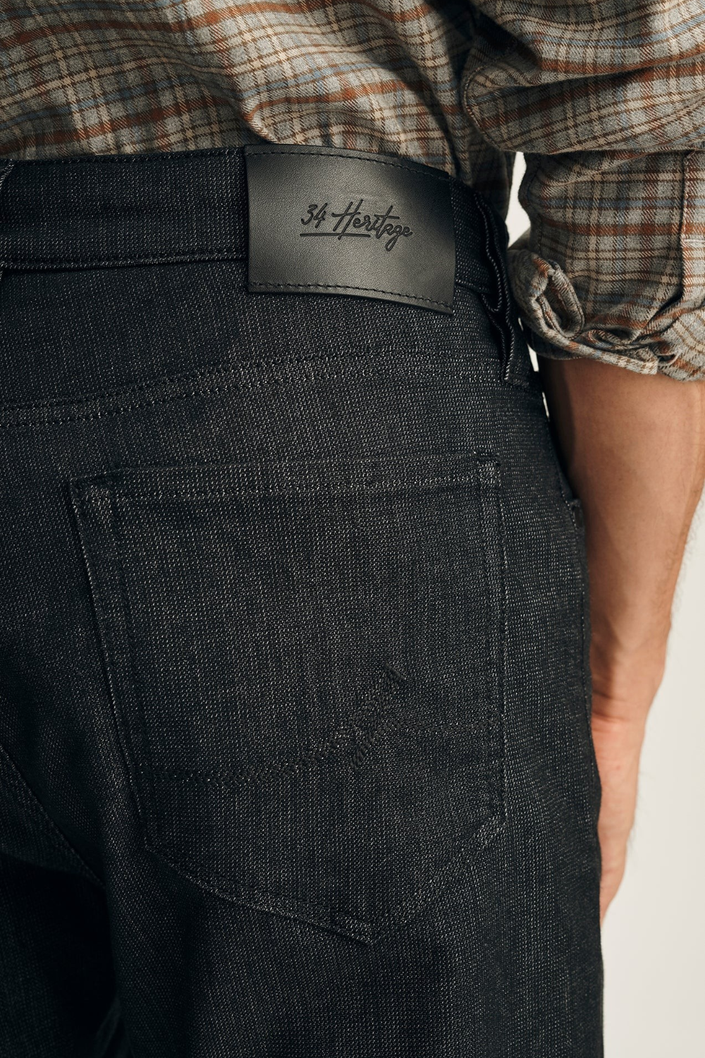 Broderick's Clothing Co. 34 Heritage Courage black sporty denim jeans featuring a leather brand patch on the back.
