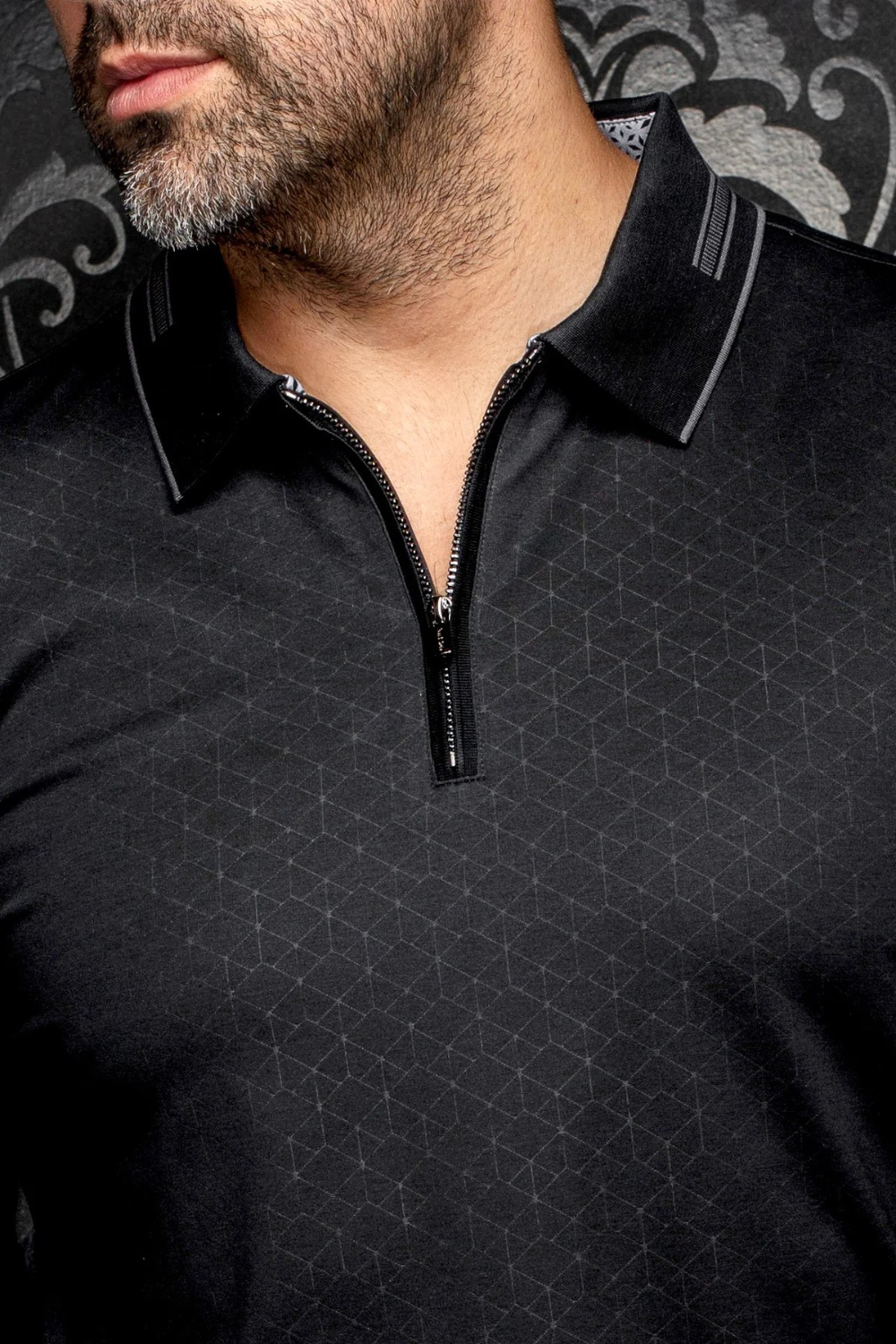 Broderick's Clothing Co. Au Noir AVENOR black long-sleeve knit polo with a geometric pattern and quarter-zip closure.
