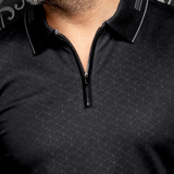 Broderick's Clothing Co. Au Noir AVENOR black long-sleeve knit polo with a geometric pattern and quarter-zip closure.