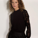 Broderick's Clothing Co. black jumper with crew neck, lettuce trim, and intricate guipure lace mesh sleeves.