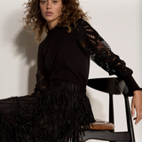 Broderick's Clothing Co. black knit sweater with intricate guipure lace mesh sleeves and lettuce trim crew neck