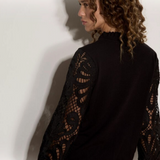 Broderick's Clothing Co. black jumper with intricate guipure lace mesh sleeves and a lettuce trim crew neck