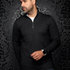 Broderick's Clothing Co. Au Noir BONNEFOI black quarter-zip sports sweater worn by a man against a damask background.