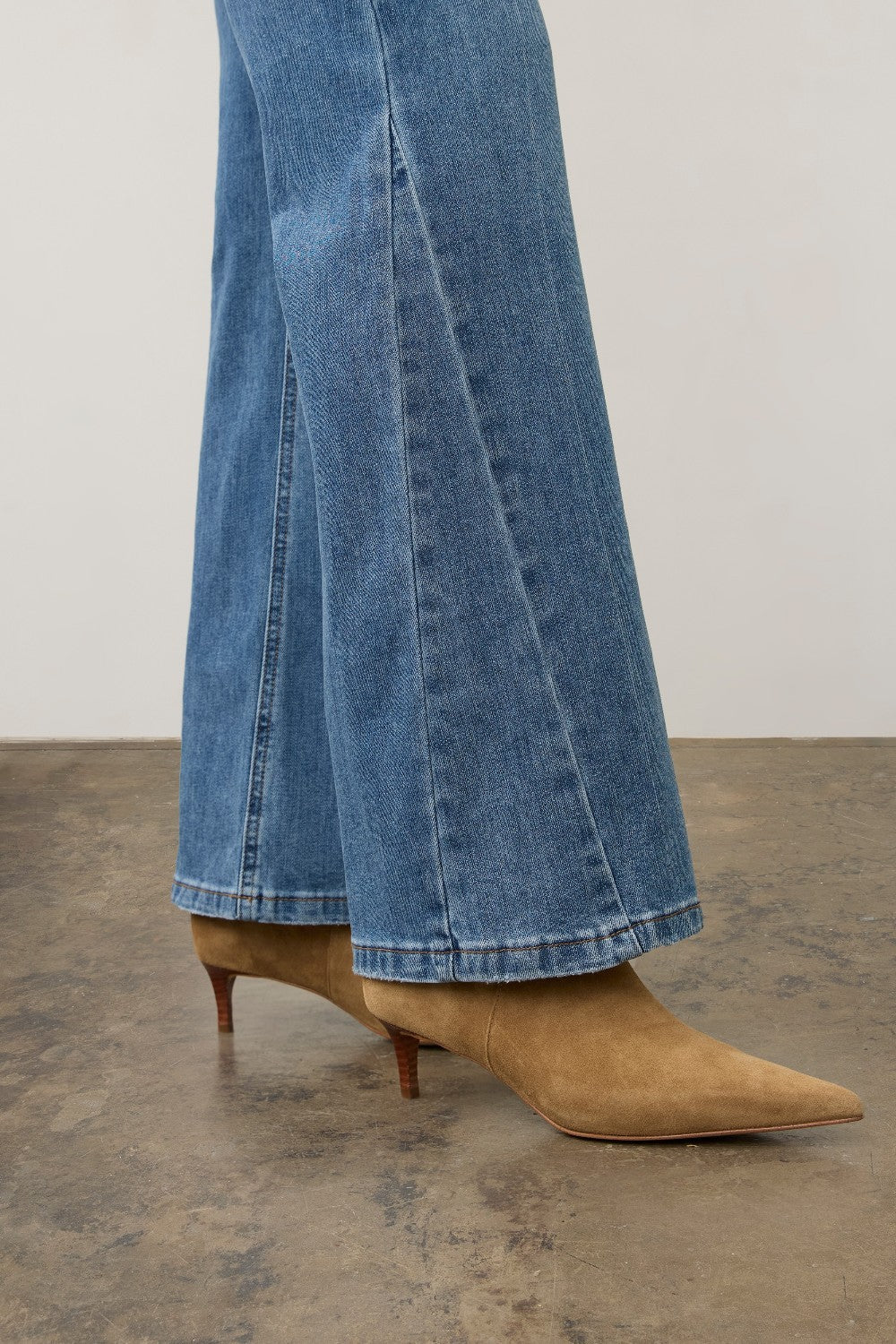 Broderick's Clothing Co. FDJ Olivia medium blue denim bootcut jeans with panel detail worn with tan suede boots