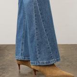 Broderick's Clothing Co. FDJ Olivia medium blue denim bootcut jeans with panel detail worn with tan suede boots