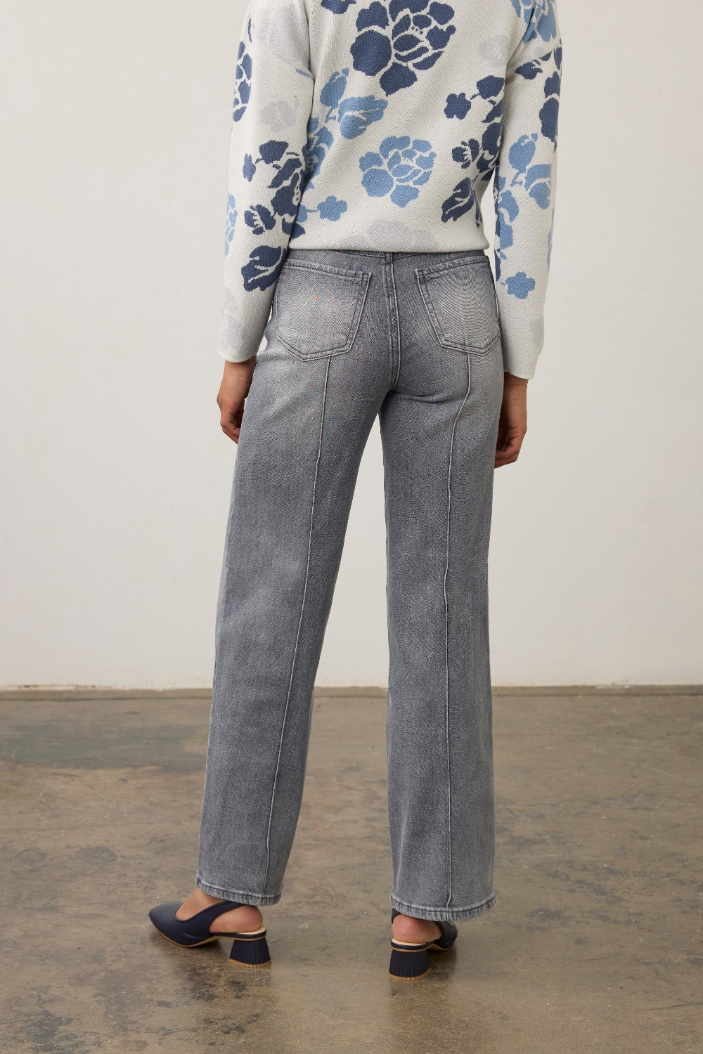 Back view of Broderick's Clothing Co. FDJ Olivia blue-gray wide-leg jeans with pintuck detail and back pockets.