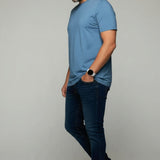 Broderick's Clothing Co. Au Noir C-MAVEN blue modal and mercerized cotton t-shirt worn by a man in jeans and sneakers