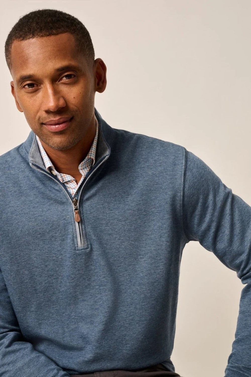 Broderick's Clothing Co. blue cotton-blend quarter-zip pullover worn by a man over a plaid collared shirt