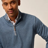 Broderick's Clothing Co. blue cotton-blend quarter-zip pullover worn by a man over a plaid collared shirt