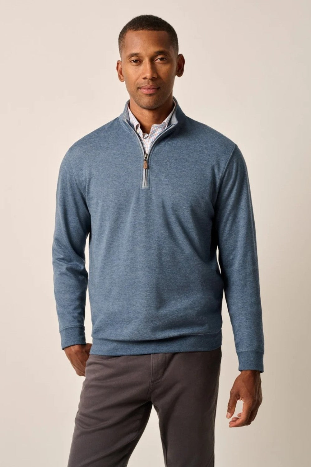 Broderick's Clothing Co. Johnnie-O blue cotton-blend quarter-zip pullover worn by a man on a neutral background.