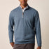 Broderick's Clothing Co. Johnnie-O blue cotton-blend quarter-zip pullover worn by a man on a neutral background.