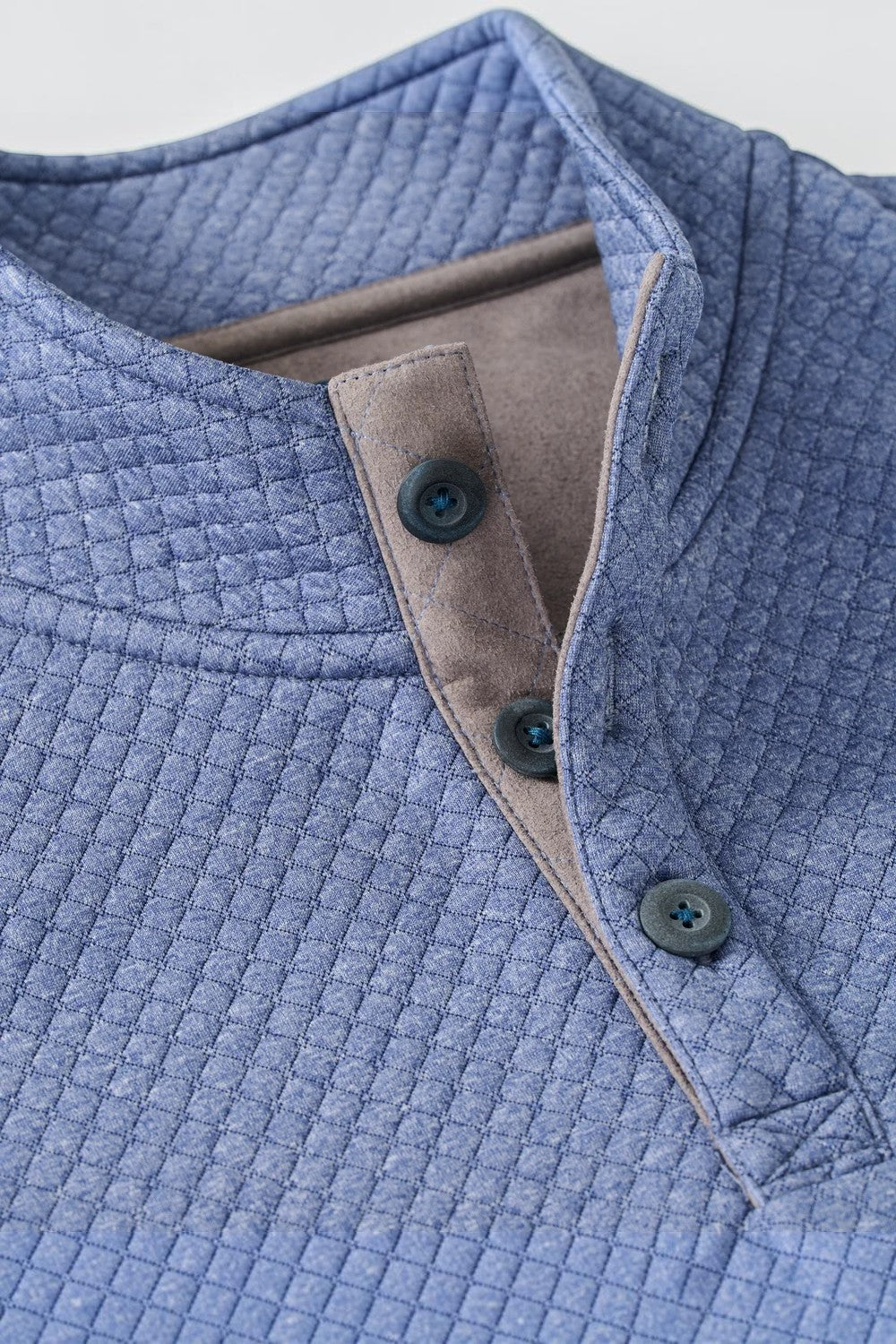 Broderick's Clothing Co. blue moratronic diamond quilted henley pullover with alcantara suede placket detail.