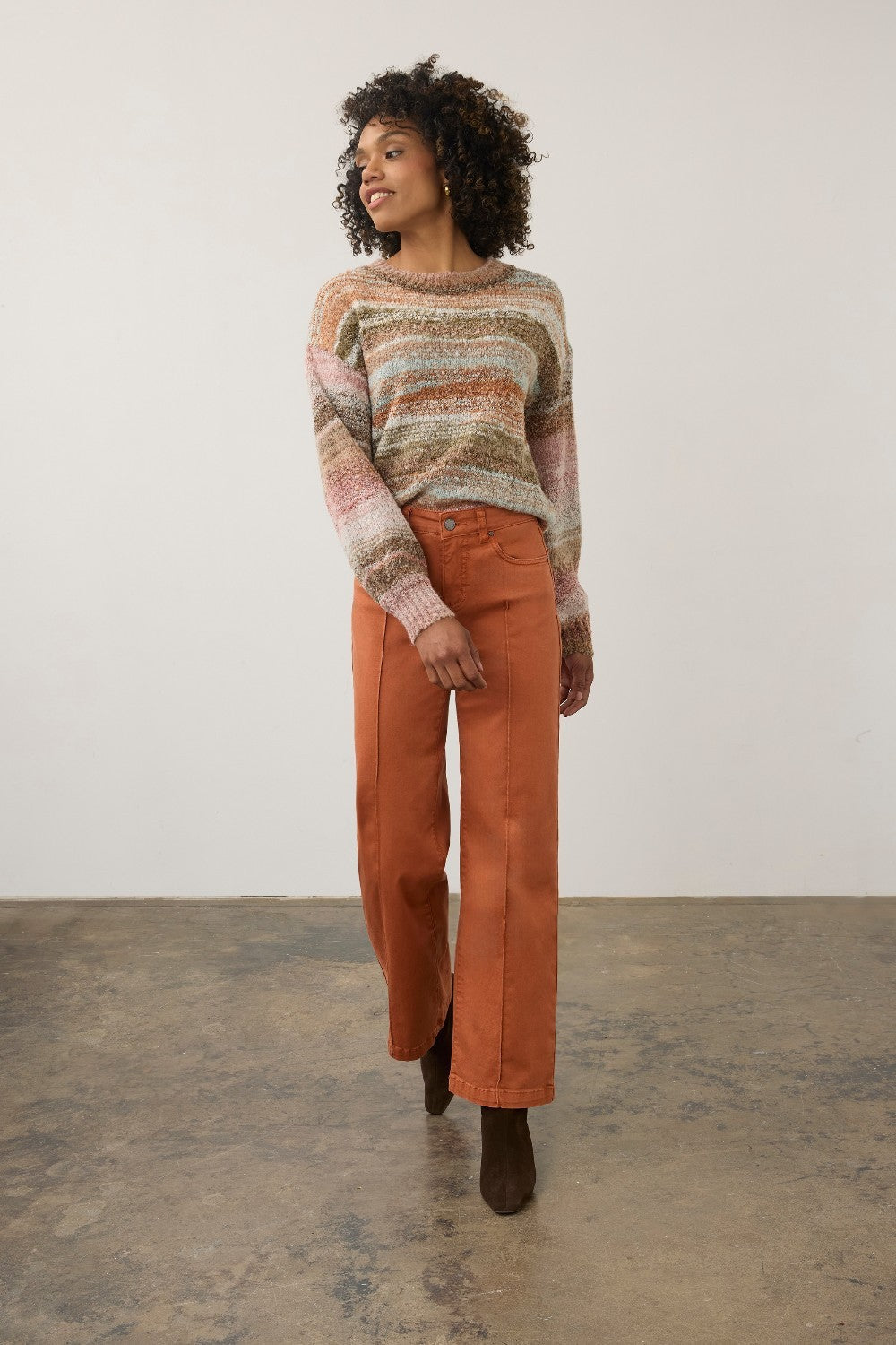 Model wearing a Broderick's Clothing Co. FDJ boat neck sweater in a multi-coloured textured boucle knit
