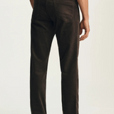 Broderick's Clothing Co. 34 Heritage brown corduroy-style straight leg pants worn by a man from the back view.