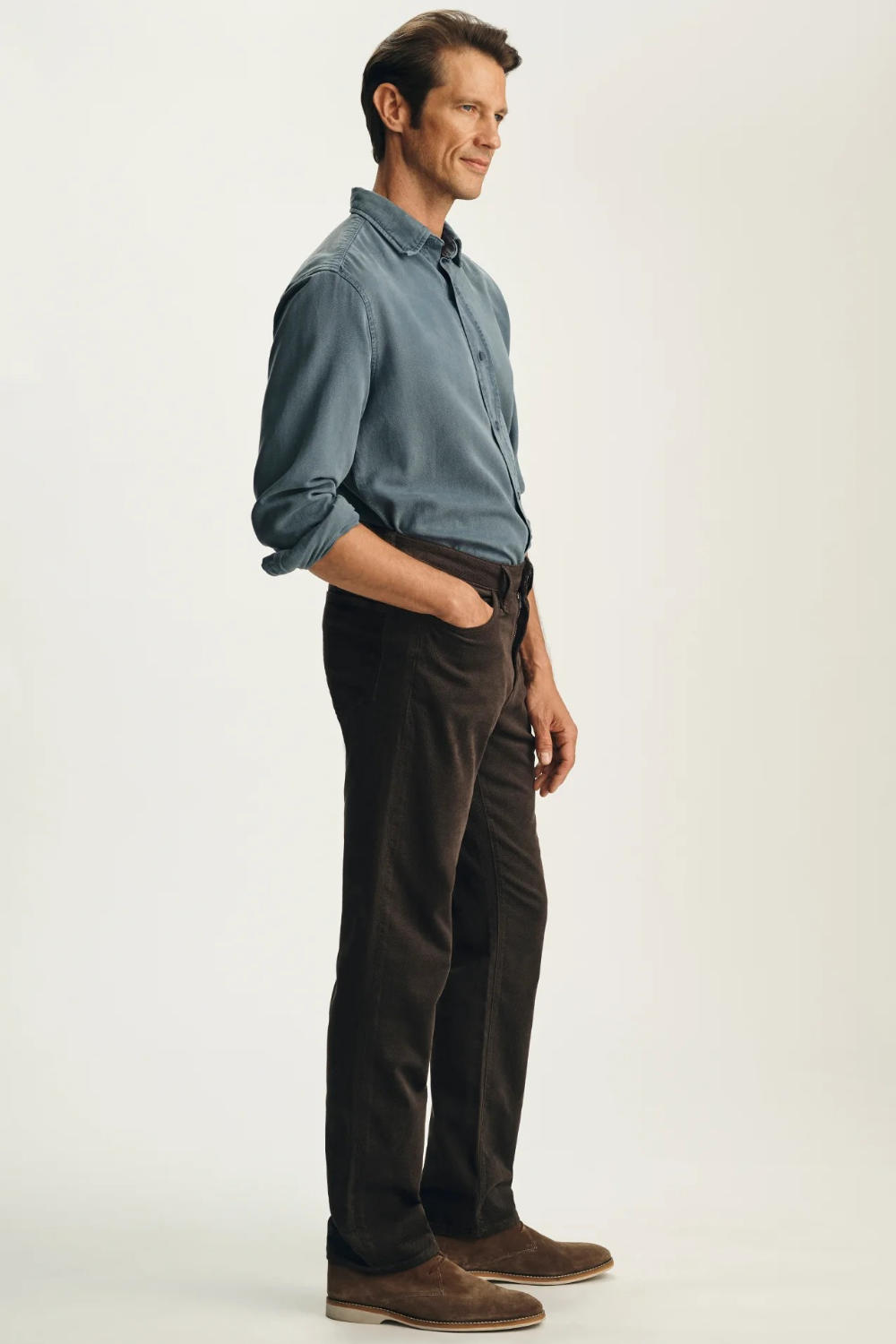Broderick's Clothing Co. 34 Heritage Charisma brown corduroy-style straight leg pants worn by a man in a blue shirt.