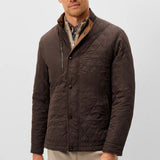 Broderick's Clothing Co. Johnnie-O Juno brown diamond-quilted snap jacket with suede trim worn by a man