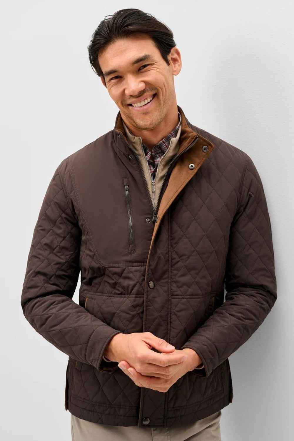Broderick's Clothing Co. Johnnie-O Juno brown diamond-quilted snap jacket with suede trim worn by a smiling man