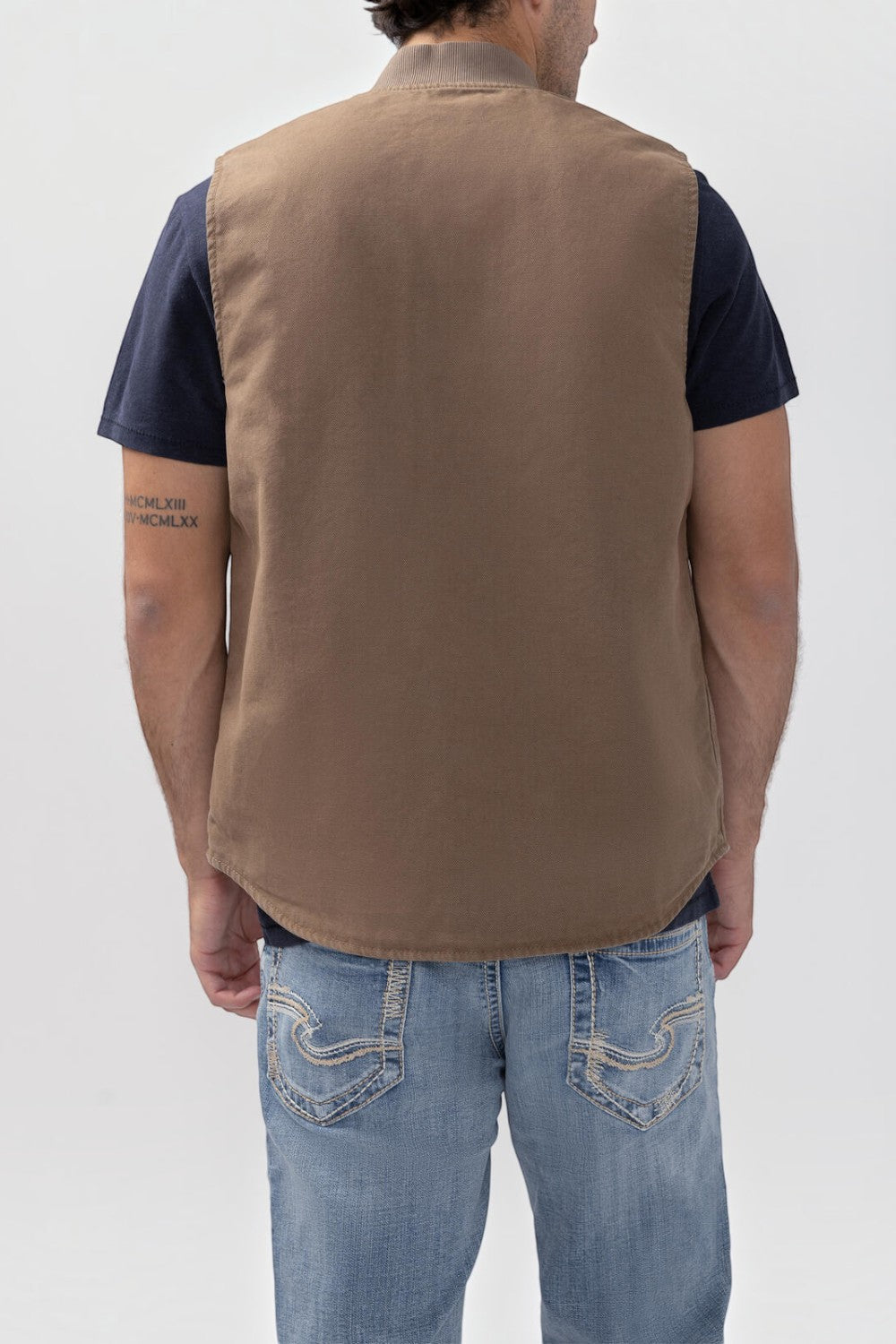 Broderick's Clothing Co. brown taupe lined workwear vest with a stand collar, shown from the back on a model.