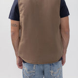 Broderick's Clothing Co. brown taupe lined workwear vest with a stand collar, shown from the back on a model.
