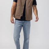 Broderick's Clothing Co. brown taupe workwear vest with zip front and patch pockets worn over a black t-shirt