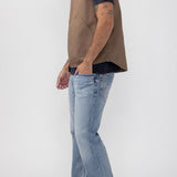 Broderick's Clothing Co. brown taupe workwear vest with zip front and patch pockets worn by a man in blue jeans