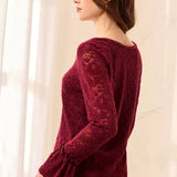 Broderick's Clothing Co. burgundy lace top with long flared sleeves and scalloped hem worn with blue jeans