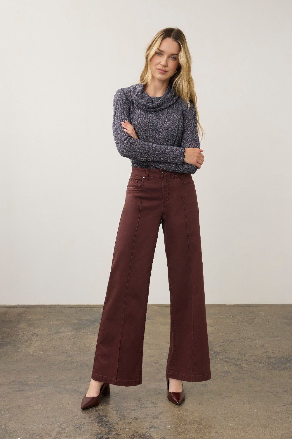 Broderick's Clothing Co. FDJ Olivia wide-leg pants in burgundy euro twill cotton with pintuck detailing on a model