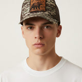 Broderick's Clothing Co. Goorin Bros. camo trucker hat with an engraved bear patch worn by a young man